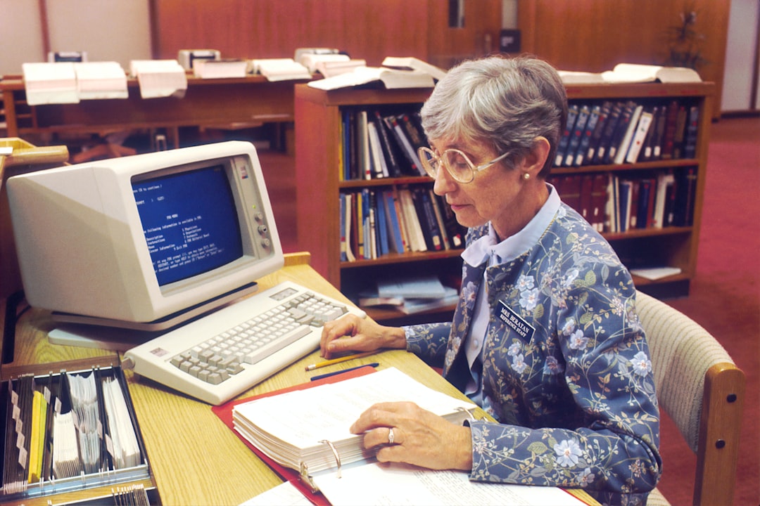 Woman sitting at desk with desktop computer