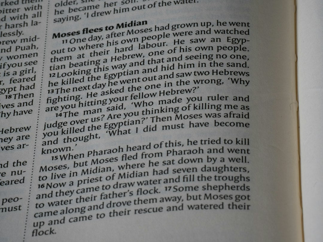 Close-up of an open book with text on pages