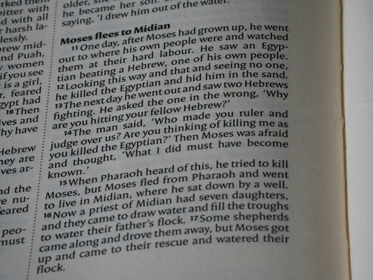 Close-up of an open book with text on pages